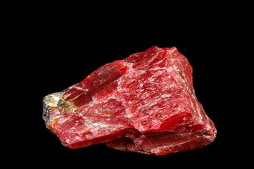 macro mineral Rhodonite stone on a black background