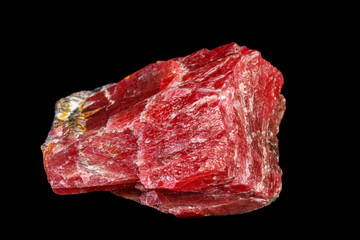 macro mineral Rhodonite stone on a black background