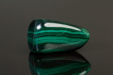 macro mineral stone malachite on a black background