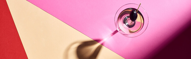 Top view of martini cocktail on colorful background, panoramic shot