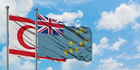 Northern Cyprus and Tuvalu flag waving in the wind against white cloudy blue sky together. Diplomacy concept, international relations.