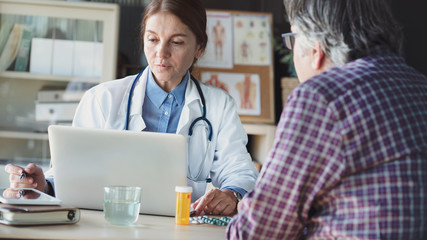 Doctor with patient in medical office