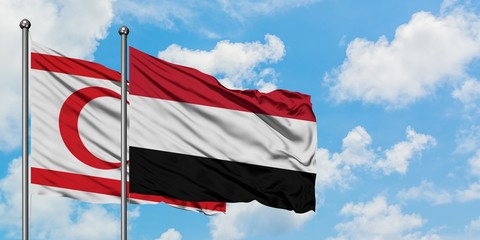 Northern Cyprus and Yemen flag waving in the wind against white cloudy blue sky together. Diplomacy concept, international relations.