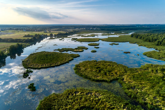 Beautiful aerial shot of a large forest lake.