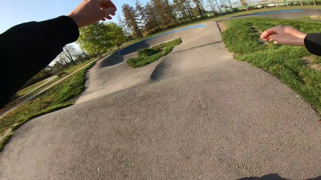 Man rides a Asphalt Pumptrack on Inline Skates POV