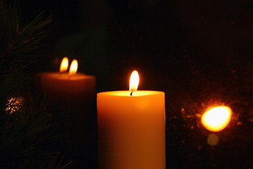 Mysterious Golden light of the candle reflected in glass, Christmas divination