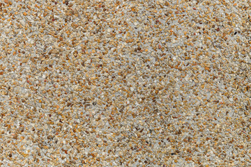 Mosaic of tiny gravel stones. colorful different colors gravel background, rock pieces stone wall texture background.surface for any design.