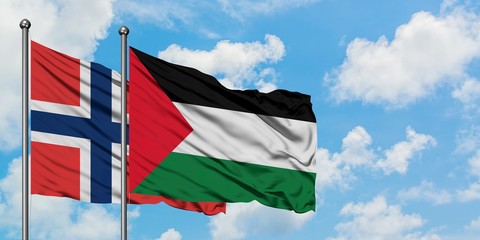Naklejka na ściany i meble Norway and Palestine flag waving in the wind against white cloudy blue sky together. Diplomacy concept, international relations.