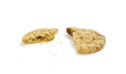 Oatmeal cookies with raisins. Broken in half cookies. Close up. Isolated on white background
