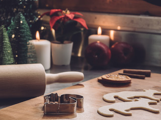 Christmas shapes on cookies dough. Home Pastry preparation on Christmas time. traditional christmas cookies with cinnamon and spice. Rolling pin, candles and christmas trees on background 7