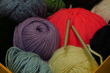 Pink knitting wool and knitting needles. Handmade