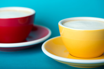yellow and red cup on a blue background