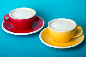 yellow and red cup on a blue background
