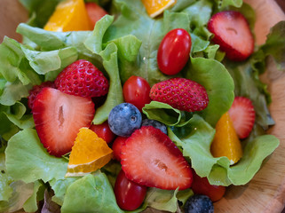 Close up of salad with fresh fruits and berries.