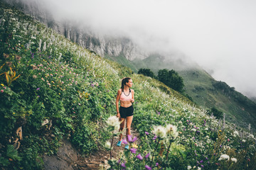 Woman running and jogging in the nature mountain scenery. Concept of healthy lifestyle. Fitness...