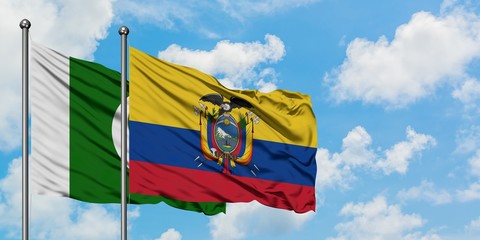 Pakistan and Ecuador flag waving in the wind against white cloudy blue sky together. Diplomacy concept, international relations.