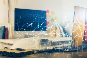 Multi exposure of graph and financial info and work space with computer background. Concept of...