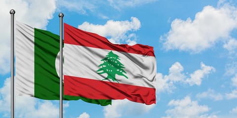 Pakistan and Lebanon flag waving in the wind against white cloudy blue sky together. Diplomacy...