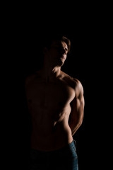 Fototapeta na wymiar shirtless sensual man posing isolated on black