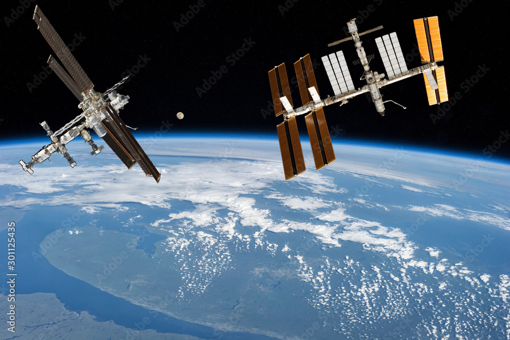 Wall mural space station. different spaceships above the earth. the elements of this image furnished by nasa.