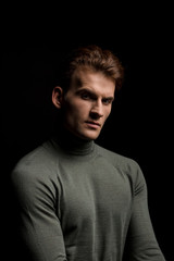 handsome sexy man posing isolated on black