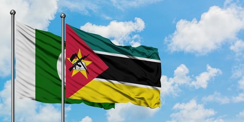 Pakistan and Mozambique flag waving in the wind against white cloudy blue sky together. Diplomacy concept, international relations.