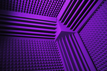 acoustic foam absorber and bass traps for sound dampering, purple background