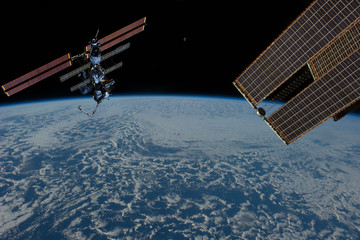 Fototapeta na wymiar Space station. Different spaceships above the earth. The elements of this image furnished by NASA.
