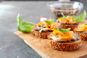 Canapes with mushrooms, cheese and carrots. Top view with copy space.