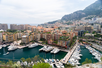 Fototapeta na wymiar Precious apartments and harbor with luxury yachts in the bay,Monte Carlo,Monaco,Europe