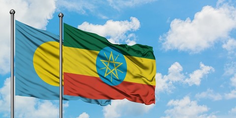 Palau and Ethiopia flag waving in the wind against white cloudy blue sky together. Diplomacy concept, international relations.