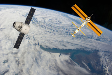 Space station. Different spaceships above the earth. The elements of this image furnished by NASA.