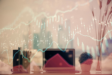 Stock market graph and table with computer background. Multi exposure. Concept of financial analysis.