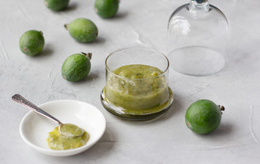 Mashed raw feijoa jam and feijoa fruits, healthy subtropical plant full of vitamin C, grown mostly  in Latin America