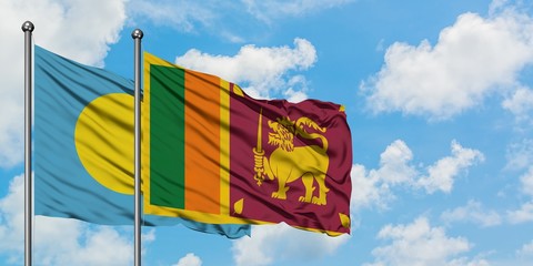 Palau and Sri Lanka flag waving in the wind against white cloudy blue sky together. Diplomacy...