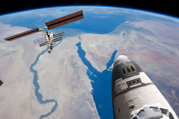 Space station. Different spaceships above the earth. The elements of this image furnished by NASA.