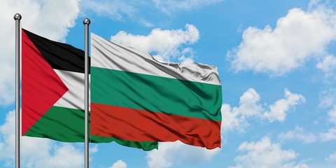 Palestine and Bulgaria flag waving in the wind against white cloudy blue sky together. Diplomacy...