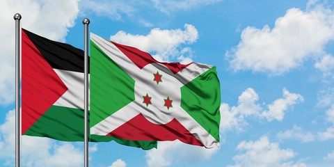 Palestine and Burundi flag waving in the wind against white cloudy blue sky together. Diplomacy concept, international relations.