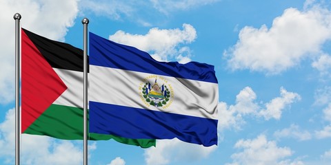 Palestine and El Salvador flag waving in the wind against white cloudy blue sky together. Diplomacy...