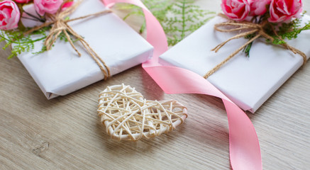 Composition with gift boxes and wooden heart