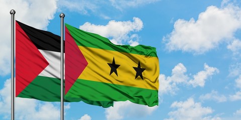 Palestine and Sao Tome And Principe flag waving in the wind against white cloudy blue sky together....