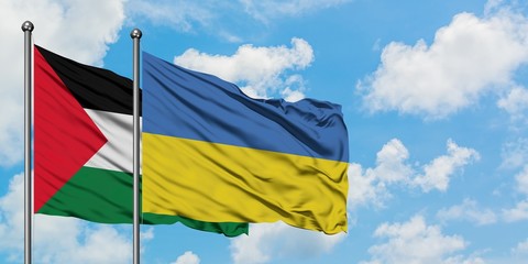 Palestine and Ukraine flag waving in the wind against white cloudy blue sky together. Diplomacy concept, international relations.