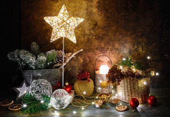 Christmas holiday decoration with shining star, fir, snow, balls and vintage toys with garland....