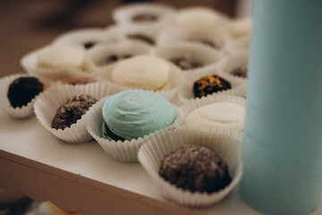Candy bar in mint color. Delicious sweets on candy buffet. Lot of colorful desserts on table. Selective focus