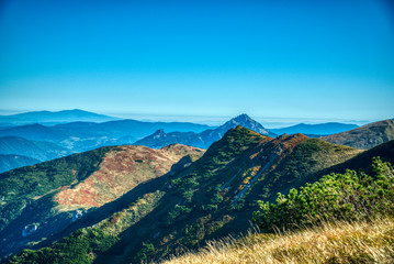 Naklejka premium beautiful mountain range in the mountains summer on a small road between Zilina and Velky Krivan,