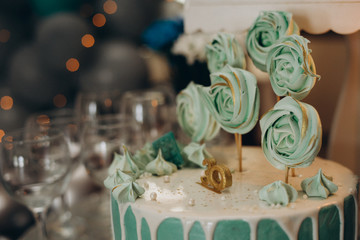 Candy bar in mint color. Delicious sweets on candy buffet. Lot of colorful desserts on table. Selective focus