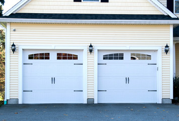 GARAGE DOOR at a typical single house painted in light blue  color