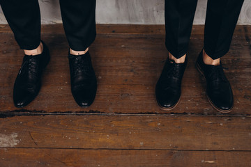 photo of the feet of the groom and friend of the groom