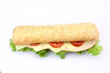 chicken sandwich, cheese and raw vegetables on a white background