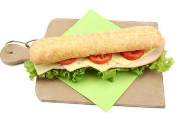 chicken sandwich, cheese and raw vegetables on a white background